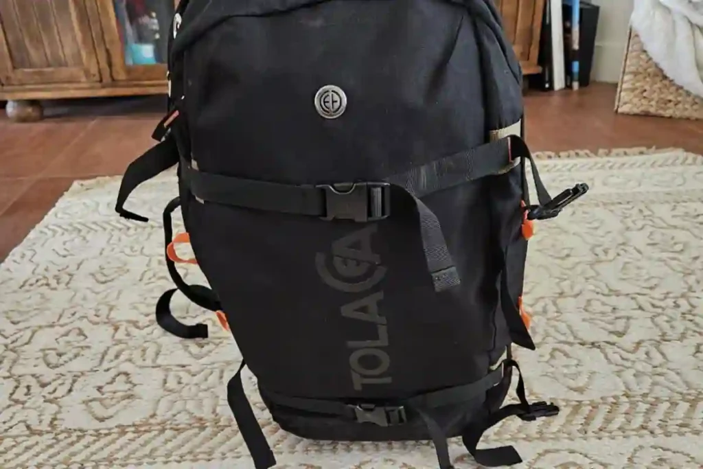 Tolaccea carry-on backpack with laptop compartment, shoe and wet/dry pockets, expandable 40–50L design, perfect for organized travelers and short trips.