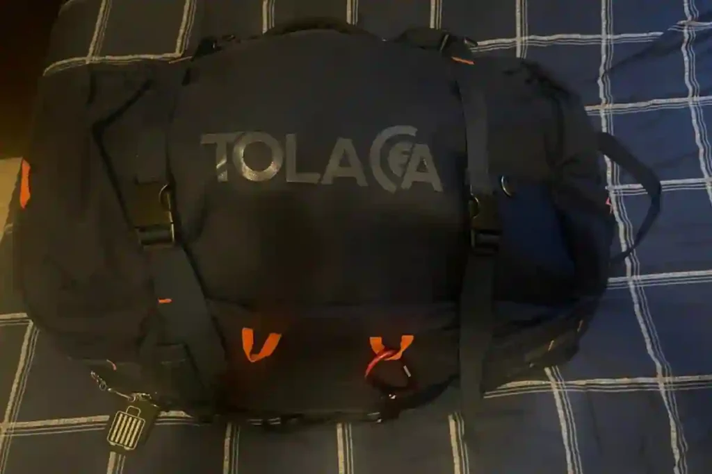 Tolaccea travel laptop backpack with waterproof compartments, chest and waist straps, fits laptops up to 17 inches, perfect for business trips and camping adventures.