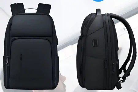 Person walking confidently through an airport wearing one of the best 17-inch laptop backpacks designed for comfort and protection.