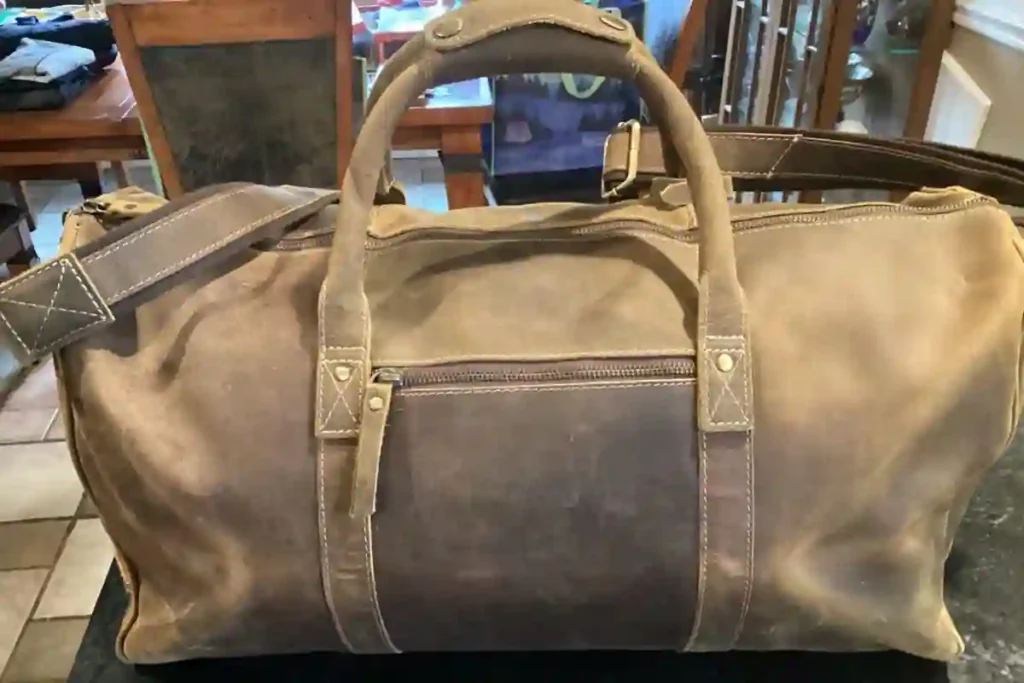 Best Leather Duffel Bags of 2026: Expert Picks for Travel, Work & Weekend Trips 7 KomalC rugged buffalo hide leather duffel bag with unique grain pattern and reinforced handles.