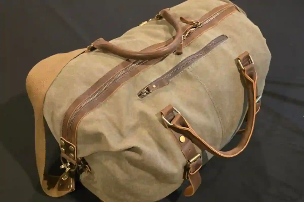 Best Leather Duffel Bags of 2026: Expert Picks for Travel, Work & Weekend Trips 5 S-ZONE canvas duffel with leather trim, showing vintage style and budget-friendly travel design.