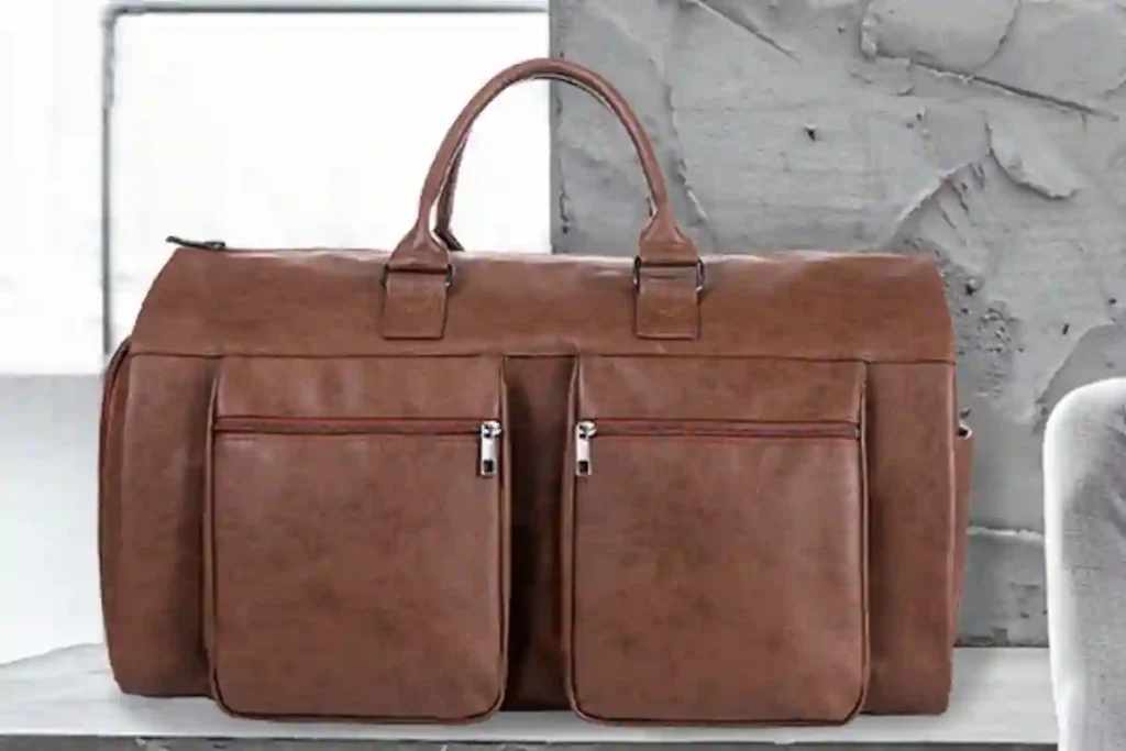 Best Leather Duffel Bags of 2026: Expert Picks for Travel, Work & Weekend Trips 3 Seyfocnia 2-in-1 garment duffel bag opened flat, showing wrinkle-free suit compartment and travel storage.