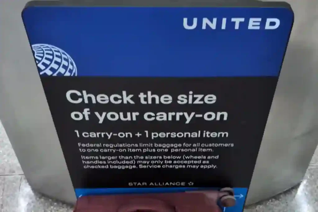 STOP GUESSING: 8 Best Carry-On Bags That ACTUALLY Fit Airline Sizers (Tested on 39 Airlines) 1 Traveler comparing suitcase dimensions with an airline sizer box to highlight misleading size rules.