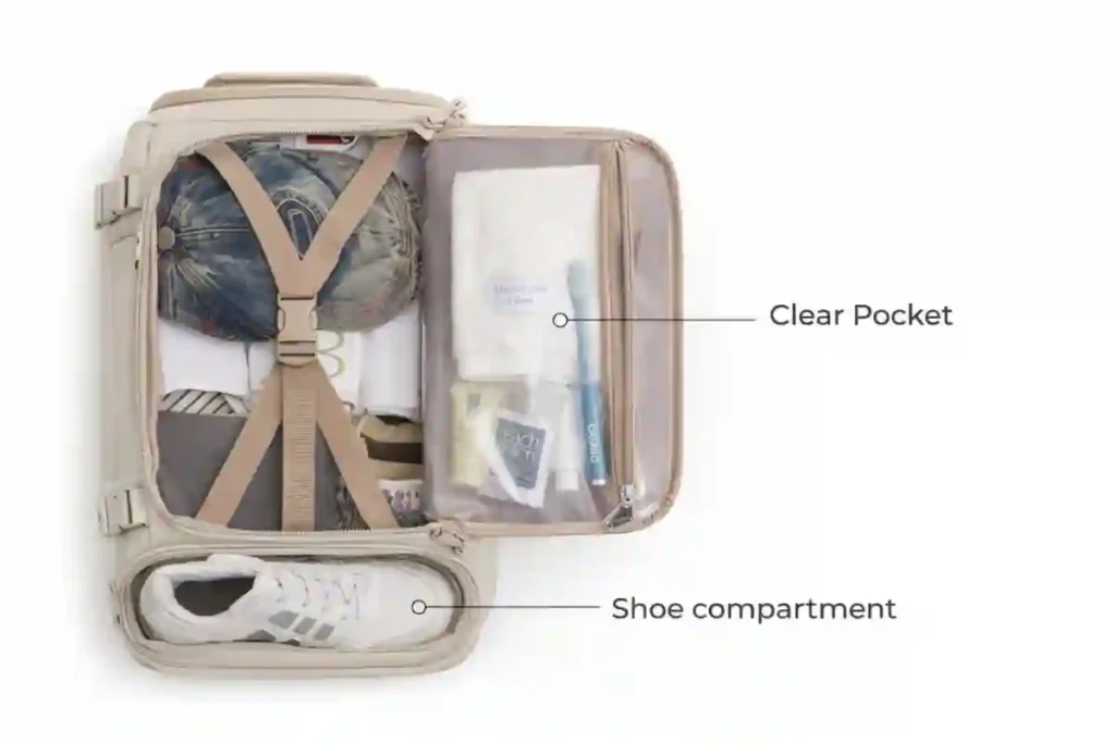 BAGSMART Blast 25L travel backpack opened flat showing clothes secured with compression straps, clear toiletry pocket, and dedicated shoe compartment