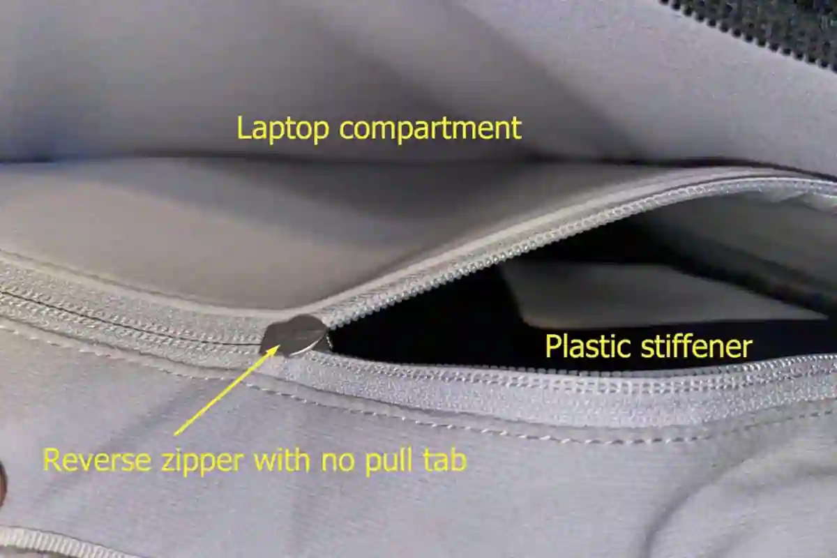 Padded laptop compartment inside the Tortuga Daily Carry Pro showing a plastic stiffener panel and reverse zipper for added device protection