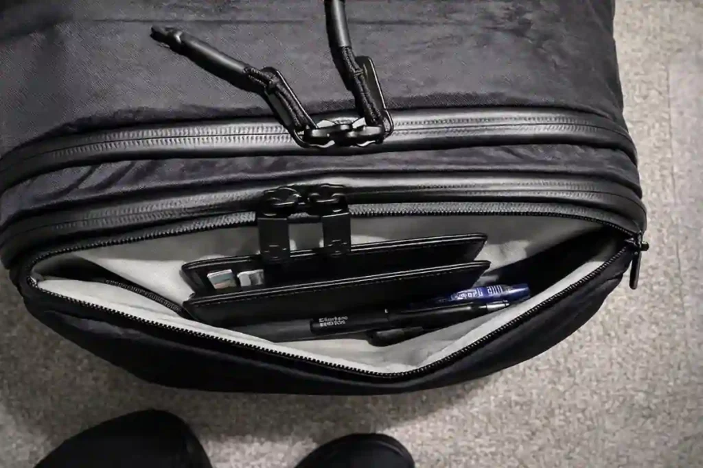 Close-up of the Tortuga Daily Carry Pro showing Ecopak EPX200 waterproof sailcloth fabric with water-resistant YKK zippers and durable hardware.