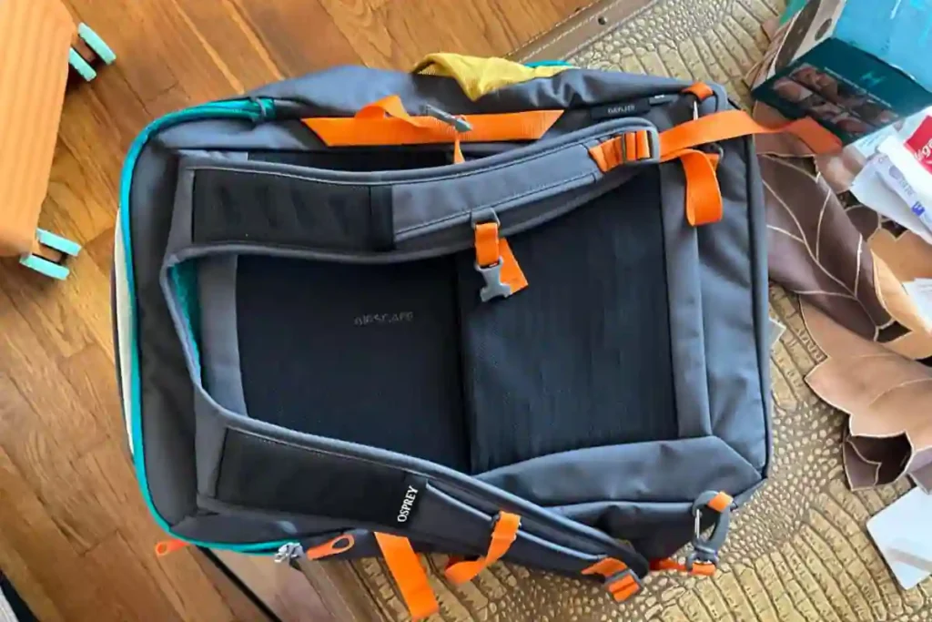Osprey Daylite Carry-On Travel Pack 35L Review – Lightweight & Practical 6 Osprey Daylite 35L backpack with shoulder straps tucked behind rear panel for overhead bin storage, keeping straps neat and secure