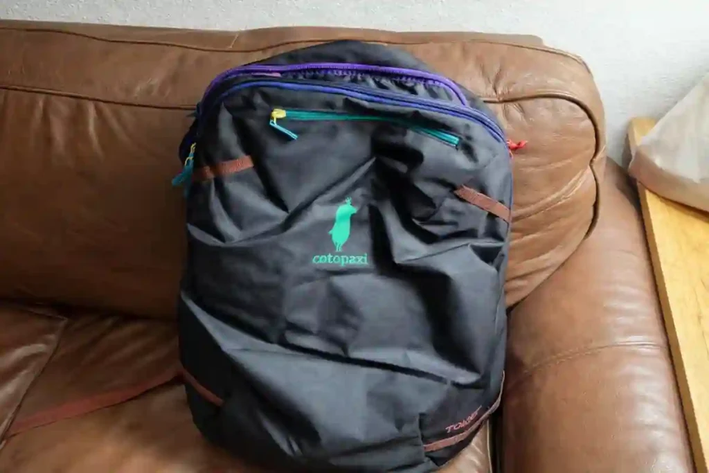 Best 35L–40L Carry-On Travel Backpacks for Flights (2026 Tested Guide) 7 Top 35L–40L carry-on travel backpacks for 2026 including Osprey Farpoint 40L, Cotopaxi Allpa 35L, tomtoc Navigator-T66, Earth Pak Roll-Top and MATEIN backpack with Travel Bag Insider logo.
