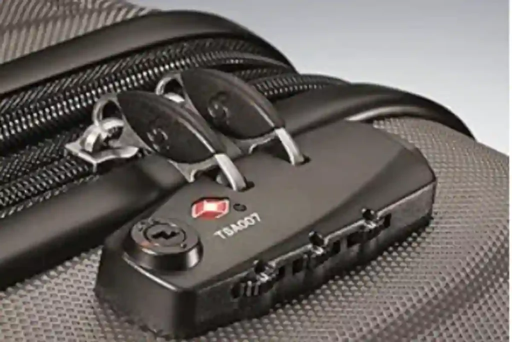 Close-up of the Samsonite Omni PC side-mounted TSA-approved combination lock on the hard-shell suitcase